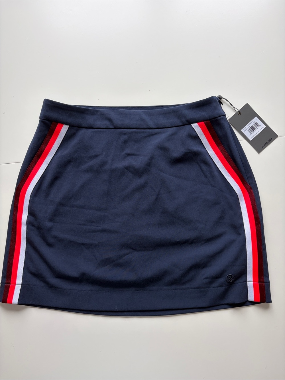 G/FORE Navy Mini Skirt with Red & White Side Stripe Accents